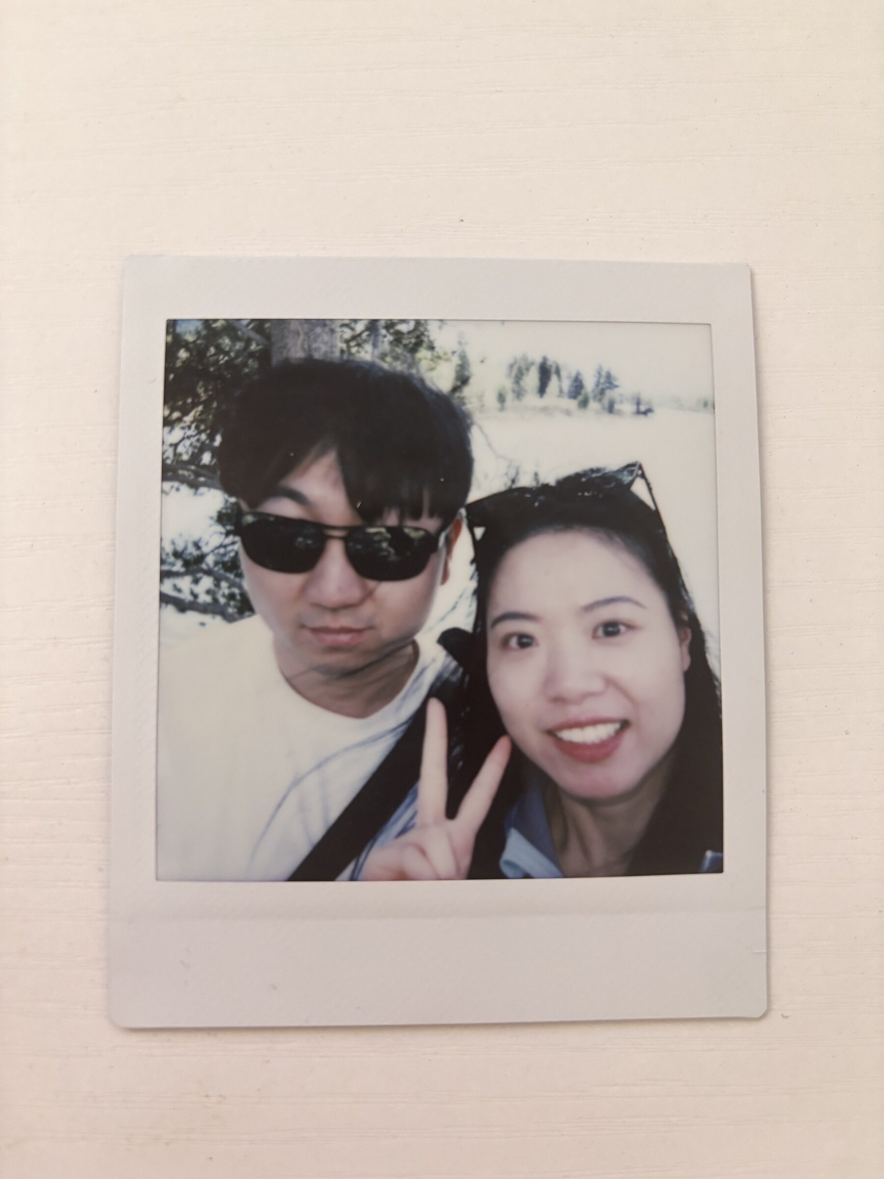 A couple smiling in a printed photo